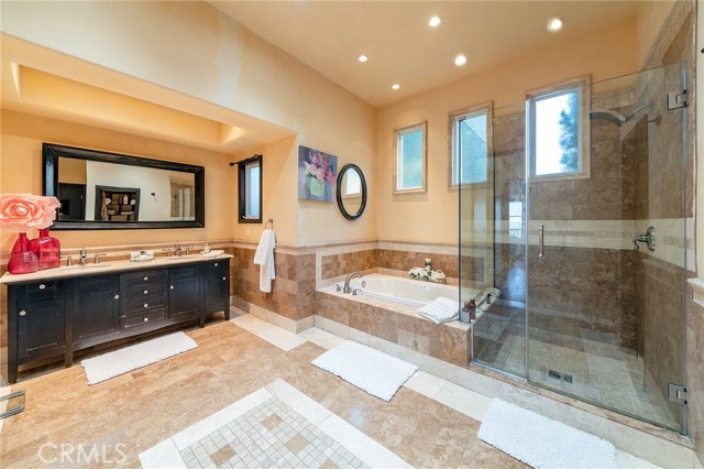 The private master bathroom is a spa-like retreat, flooded with natural light. This blissful sanctuary has an over sized jetted soaking tub, large separate shower and dry/wet sauna.