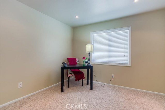 The second bedroom downstairs can be used as a quaint, home office and or guest room for family and friends from out of town.