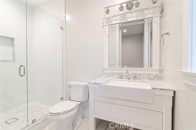 View of guest bedroom private bathroom.