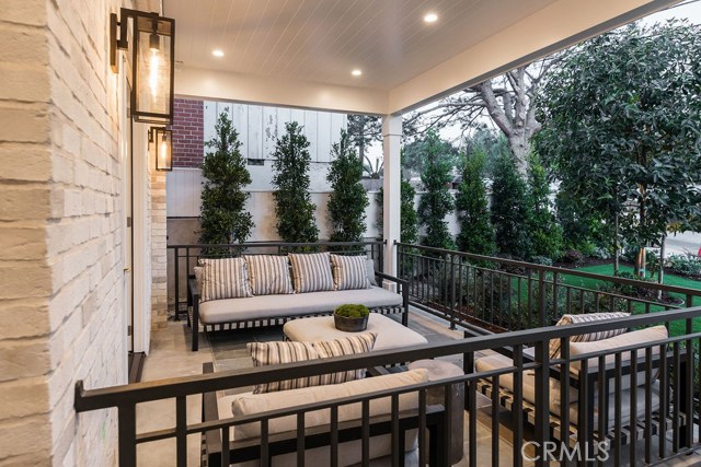 Entrance patio  surrounded by lush landscaping