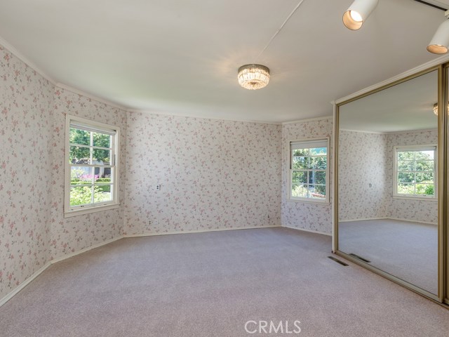 Spacious master bedroom with garden view