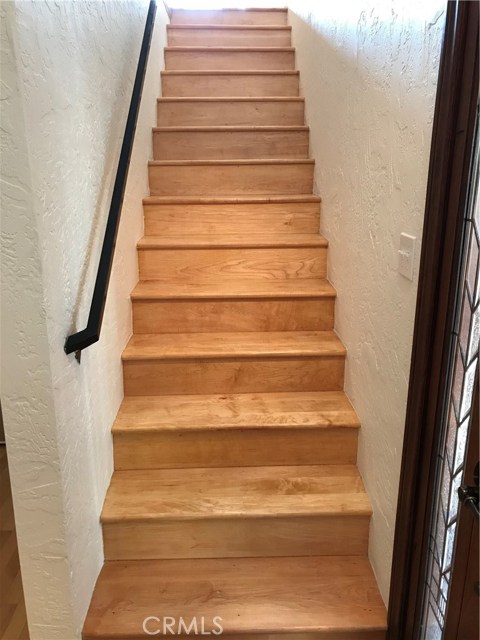 Gorgeous hard wood stairs leading to second floor.