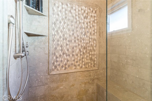 Master Bathroom (cont.) – Mosaic Backsplash & Tiled Walk-In Shower with Bench, Adjustable Showerhead and Brushed Nickel Fixtures Master Bathroom (cont.) – Mosaic Backsplash & Tiled Walk-In Shower with Bench, Adjustable Showerhead and Brushed Nickel Fixtures