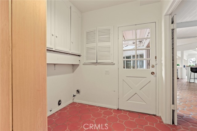 Laundry room is all the way on the left side of the home next to a private suite with bedroom and bathroom.