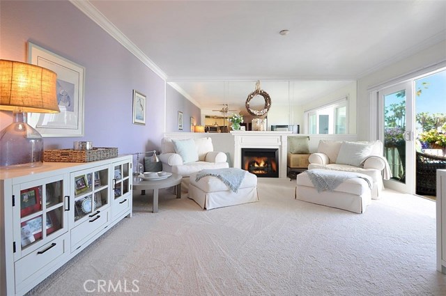 Cozy Living Room with Wainscoting, Smooth Ceilings and Crown Molding