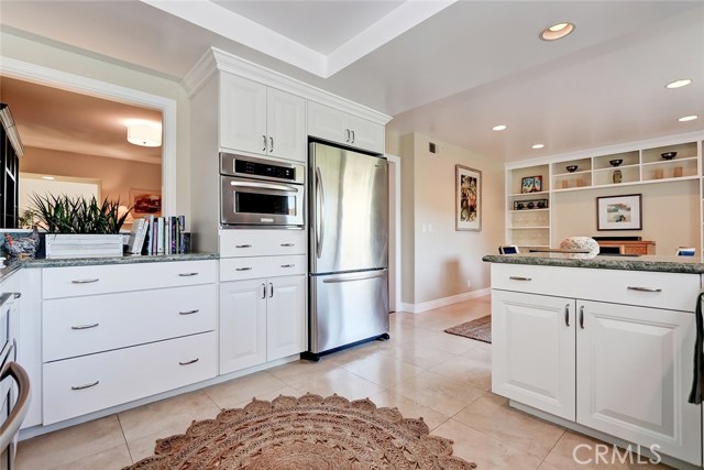 Gourmet chef's kitchen includes updated cabinets and crown molding.