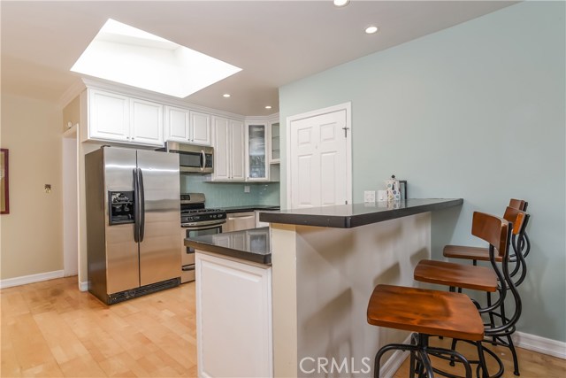 The bar counter seats three for quick meals or is a nice serving area for entertaining