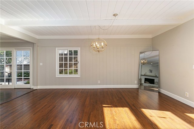 Dining area adjacent to sliding door that leads to the gated driveway on the side of the house.