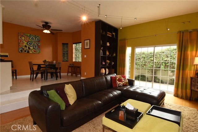 Wonderful family room is right off the casual eating area and kitchen, and opens onto the rear patio/yard!  There is a gorgeous custom made built-in display furniture, too!