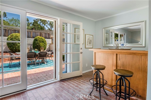 Family room with bar area opens to back patio