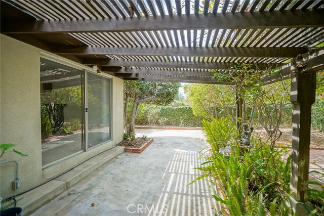 The back yard covered patio accessible from the Living Room slider.