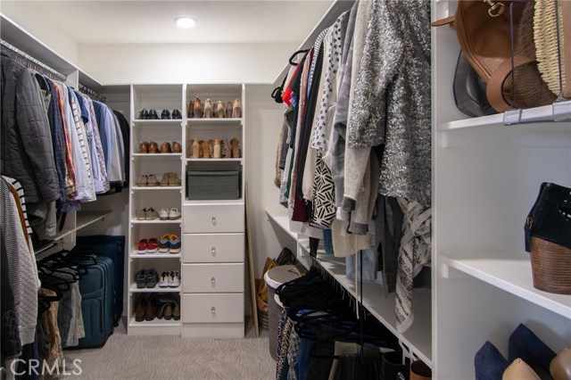 huge walk in closet is custom built