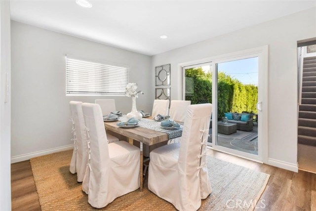 Formal dining area looking out to the beautiful backyard patio