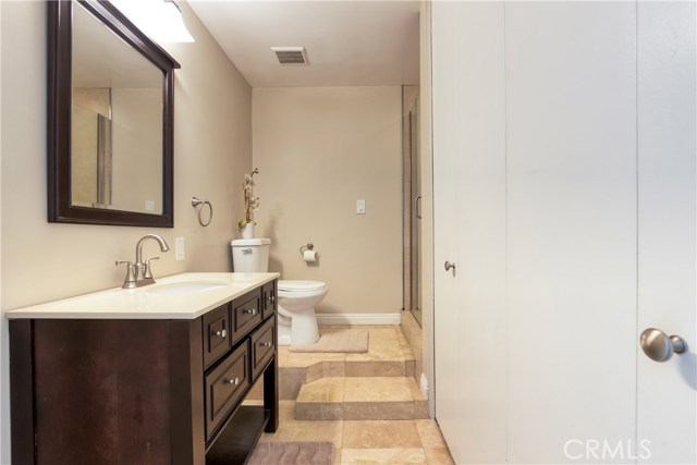 First level bathroom with washer and dryer area