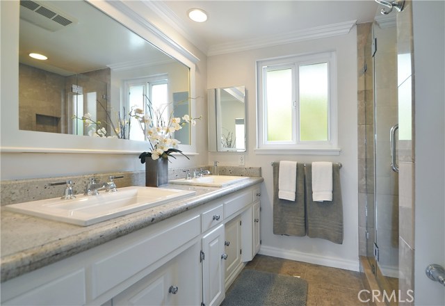 Master bathroom with double vanity and granite counters