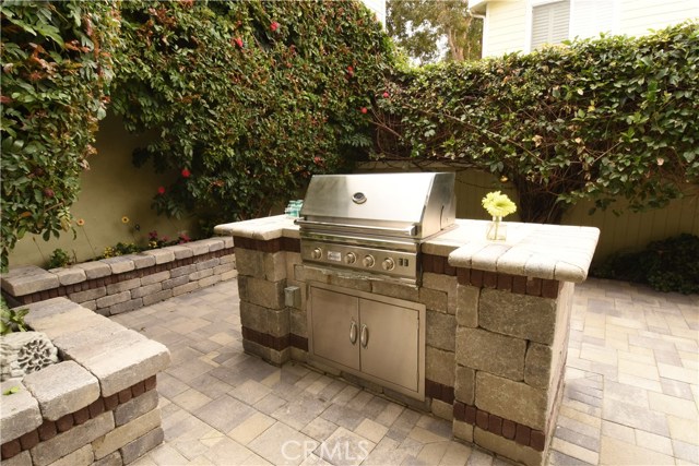 BBQ area is terrific, and the seating walls around the backyard are perfect for guests!