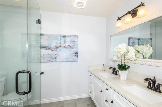 Master bathroom has double sink & quartz counter top.