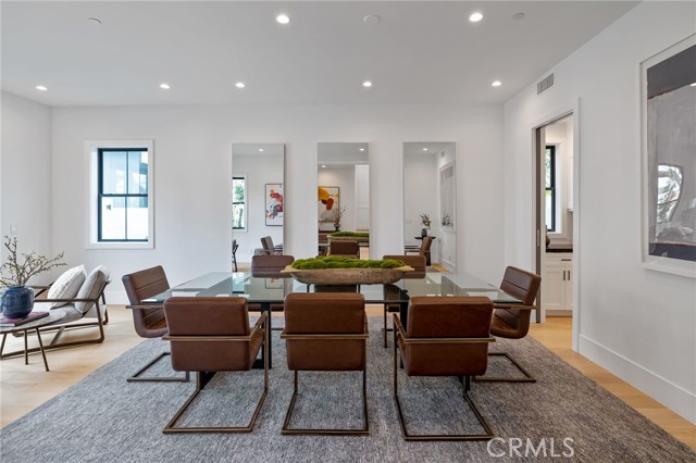 Spacious and versatile dining room that opens graciously into the front yard