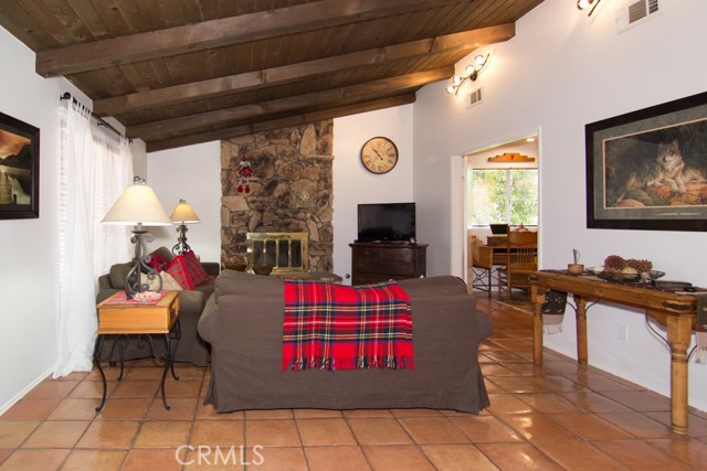 LIVING ROOM WITH COZY FIREPLACE.