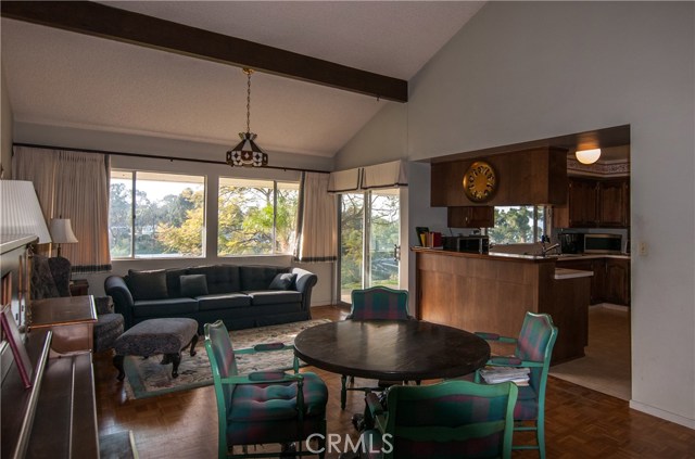 Separate family room connects to kitchen and huge covered/enclosed patio - complete with canyon/pastoral views.