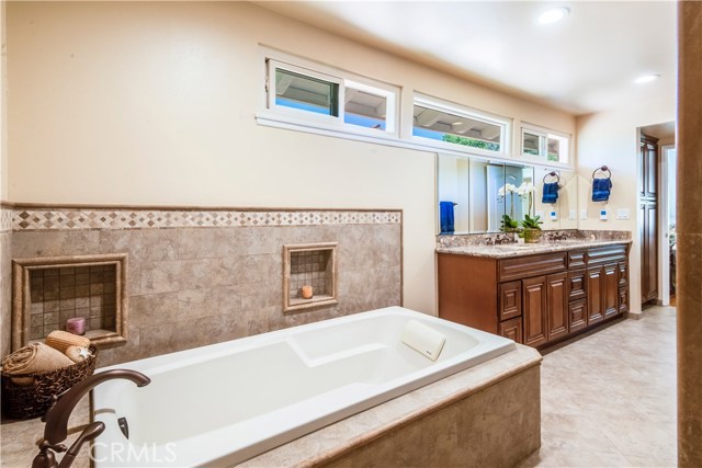 Newly remodeled master bath with heated floor, double sink vanity, spa sized tub and separate shower.