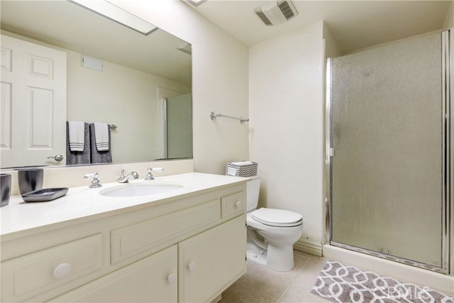 Hall bath with step-in shower.