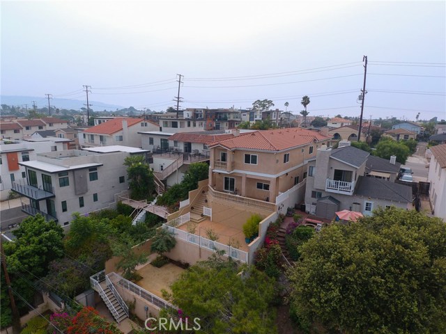 Property is fully gated. The area on the right side of this view can be a dog run with access to the interior of the house.