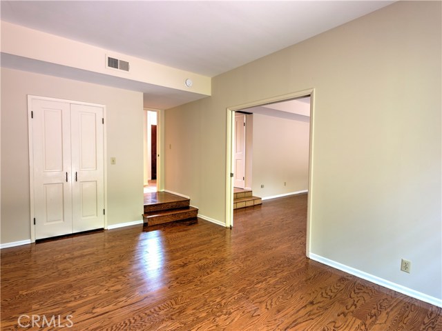 Main floor bedroom may be used as office/library/game room