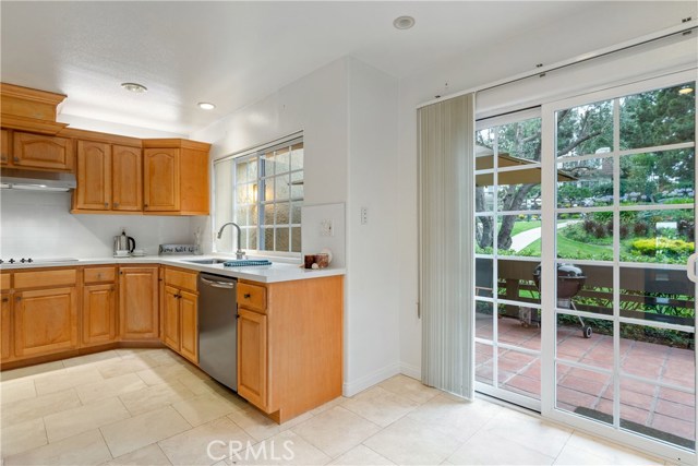 Kitchen/breakfast nook area has sliders to patio...so cheery and bright!