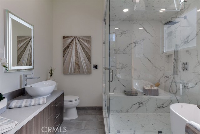 Master bath with double sink, steam shower & separate soaking tub