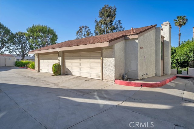 End unit with attached 2 car garage.