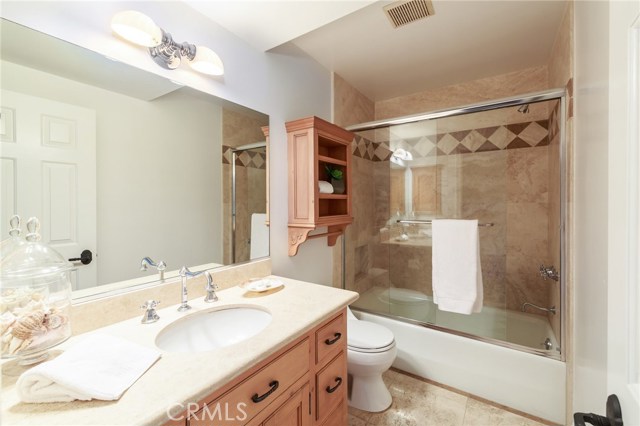 lower bathroom with stone full slab counters