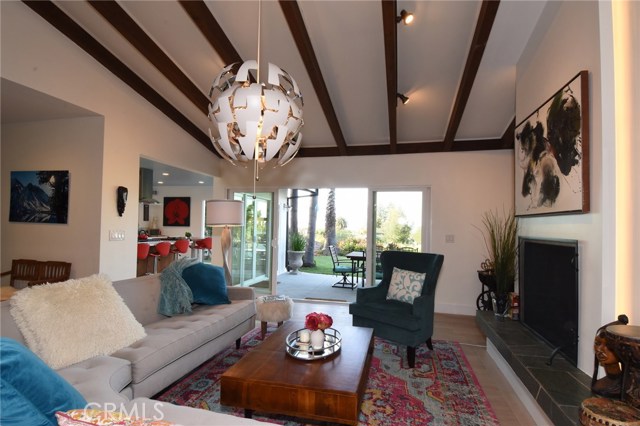 This photo shows the kitchen off of the living room, and the entry hallway to the left...