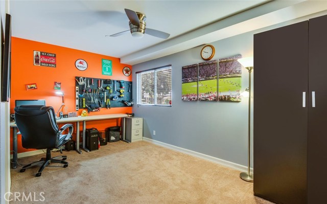 Bedroom #4 with full bathroom; office space.   This bedroom is on the ground floor and next to the garage entry.