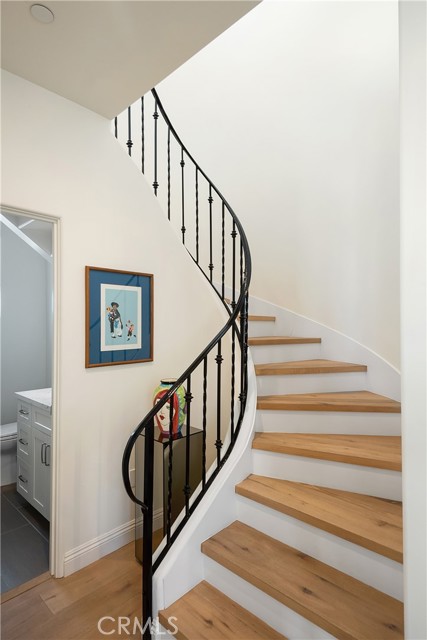 Curved staircase from the living room up to the Mezzanine
