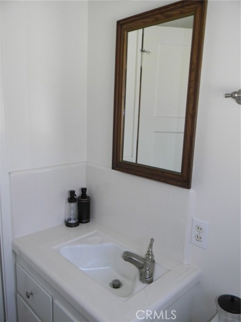 1/2 bathroom off the kitchen and den area.