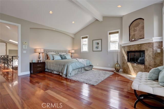 The first-class Master Bedroom enjoys it's own fireplace, exclusive balcony, vaulted ceilings and hardwood floors.