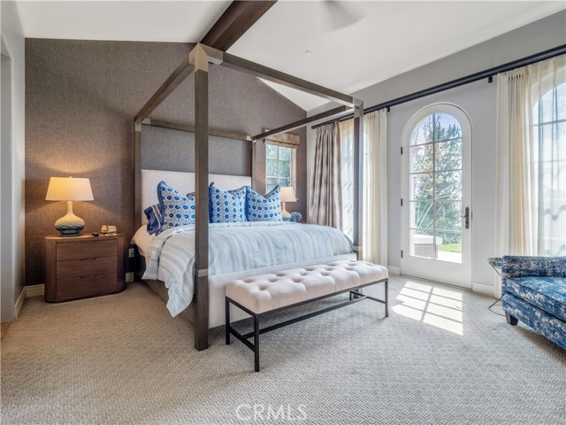 Master bedroom with French door to patio. Tons of natural light.