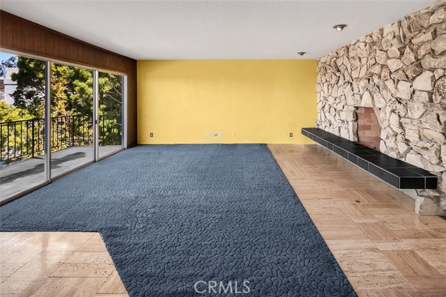 Downstairs family room with fireplace would make a fantastic master suite.