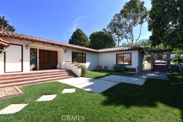 Another perspective on the main entry area showing on your right ad added gate to the front driveway