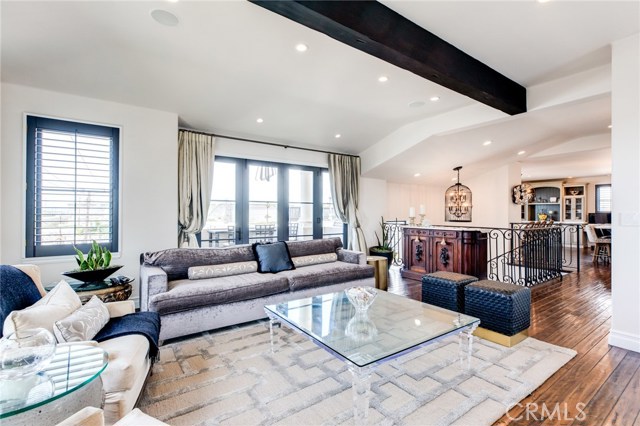 Behind the couch you will see the glass doors that lead out to the seating terrace. Enjoy the view from there or simply open the doors to hear the calming sounds of crashing waves from inside.