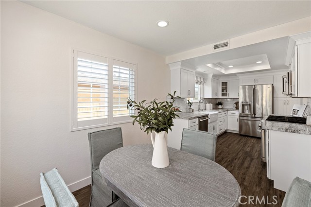 Breakfast nook area leading into the remodeled kitchen.