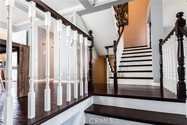Dramatic stairway adds to the charming character of this well loved home