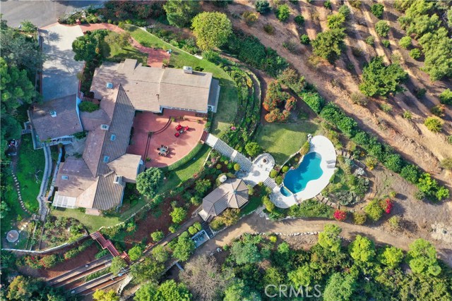 Upper Pad: View of patio, pool, pool house, and main house