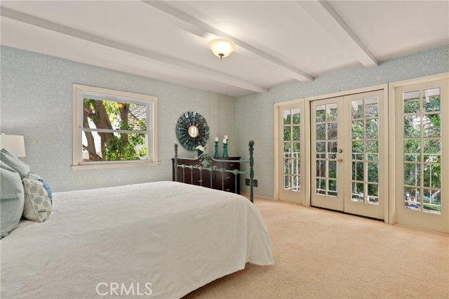 One of the two upstairs bedrooms with direct access to your balcony as well!