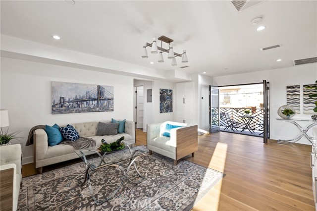 Light filled bonus room opens onto side balcony