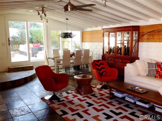 Nice Den in Back Area of the Home with Slate Floor and Fireplace, Leads to the Backyard