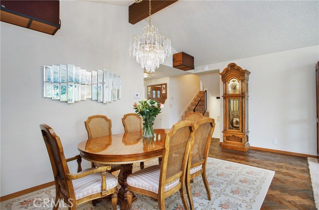 Spacious dining room with wood parquet flooring