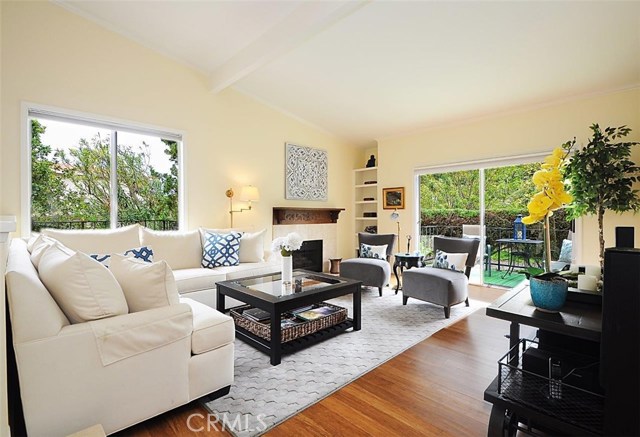Living room with Fireplace and built-in Bookshelves.