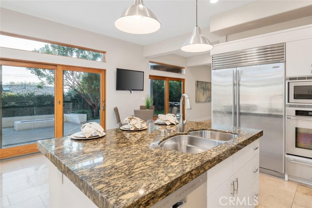 kitchen with view of garden and outdoor areas